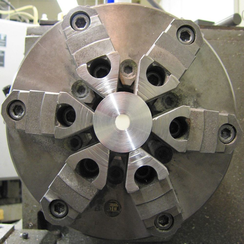 Precision machined part in a lathe chuck